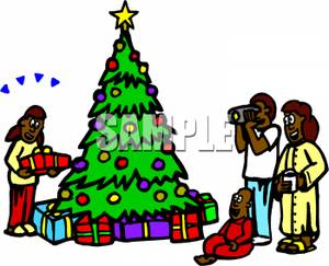 300x243 An African American Family Gathered Around A Christmas Tree Clip