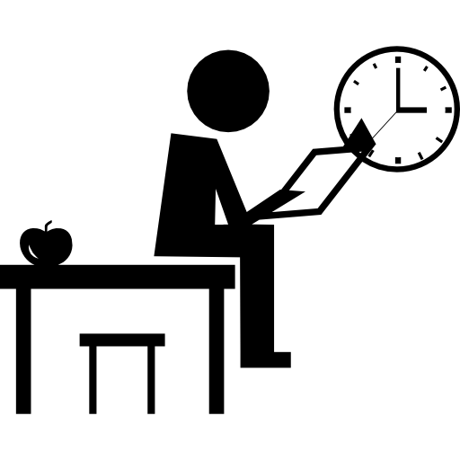 Teacher Sitting On The Class Table Reading A Book