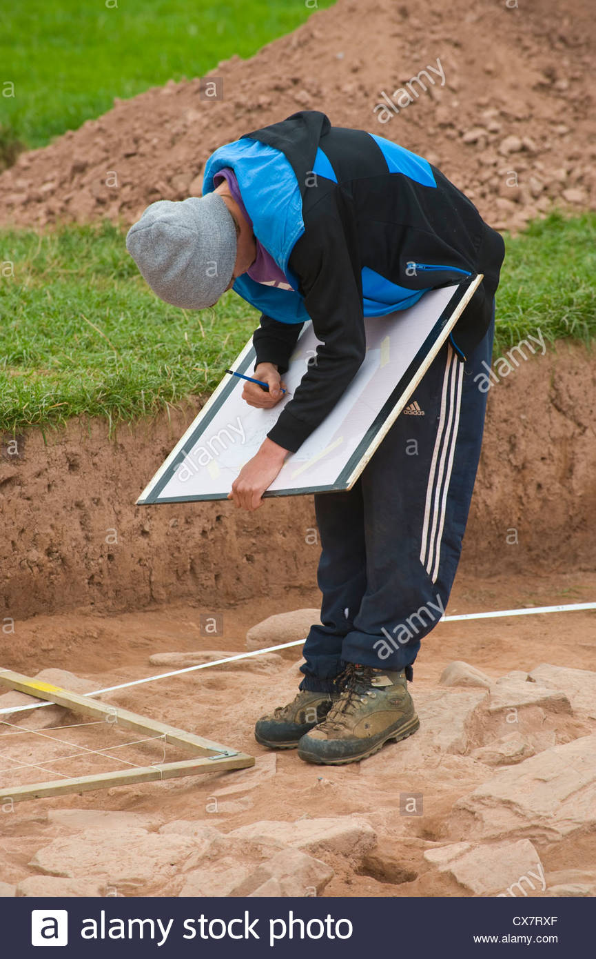 865x1390 Student Archaeologist Drawing A Section On Dig