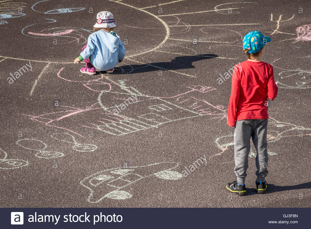 1300x957 Kids Drawing With Chalk On Asphalt Stock Photo 114403877