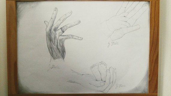 570x321 Hands. Adult Father's Hand Baby Feet Mother