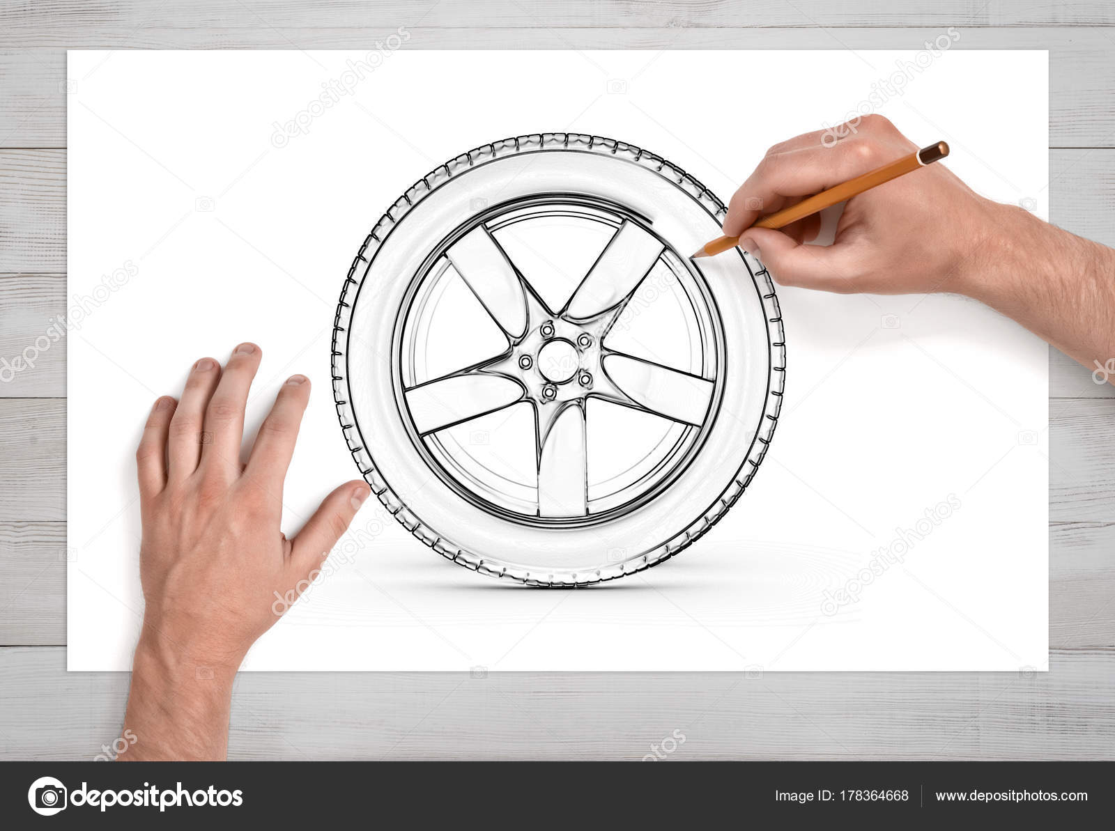 1600x1193 Two Male Hands In Close View As They Draw A Car Tire With A Pencil