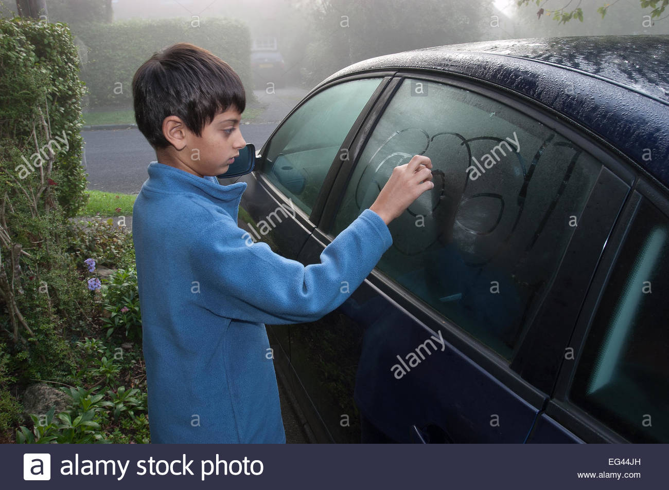 1300x954 Young Primary School Boy Drawing In And On Car Window On Damp