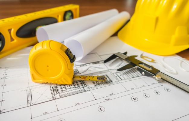 626x403 Construction Plans With Yellow Helmet And Drawing Tools On Bluep