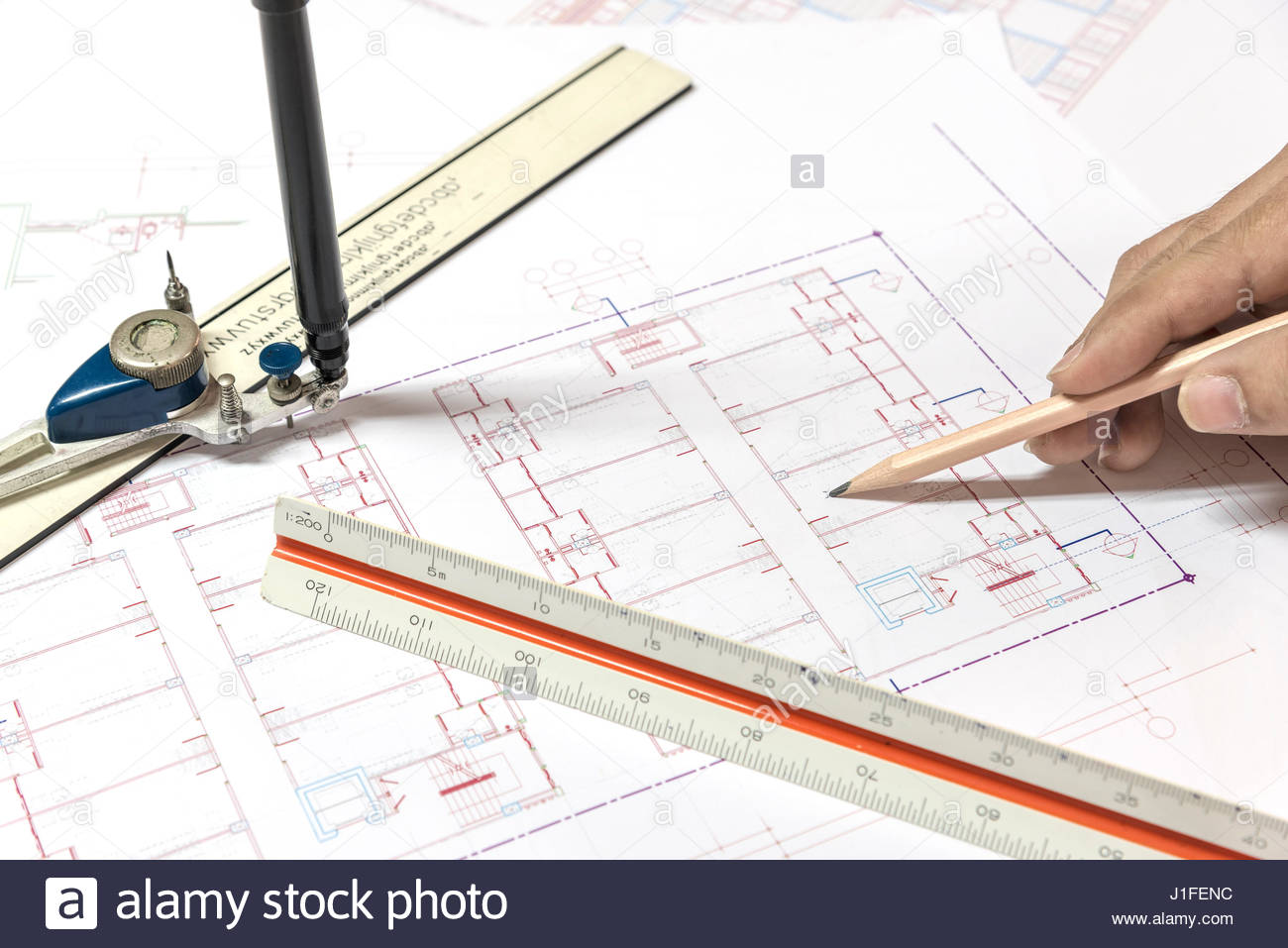 1300x957 Hand Holding Pencil Point To Architectural Plans Project Drawing