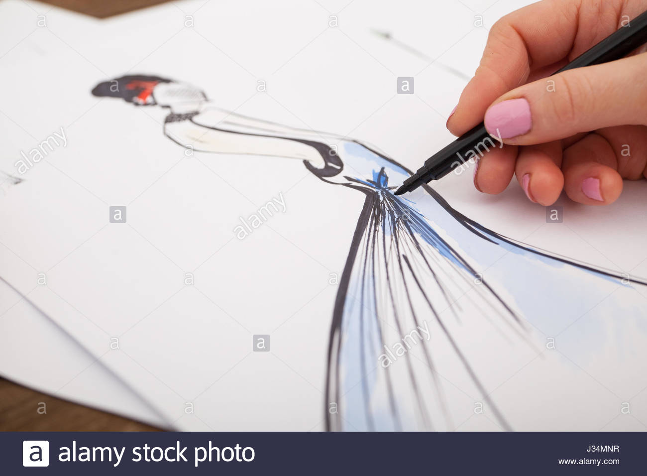 1300x956 Fashion Designer Drawing New Models Of Clothes Stock Photo