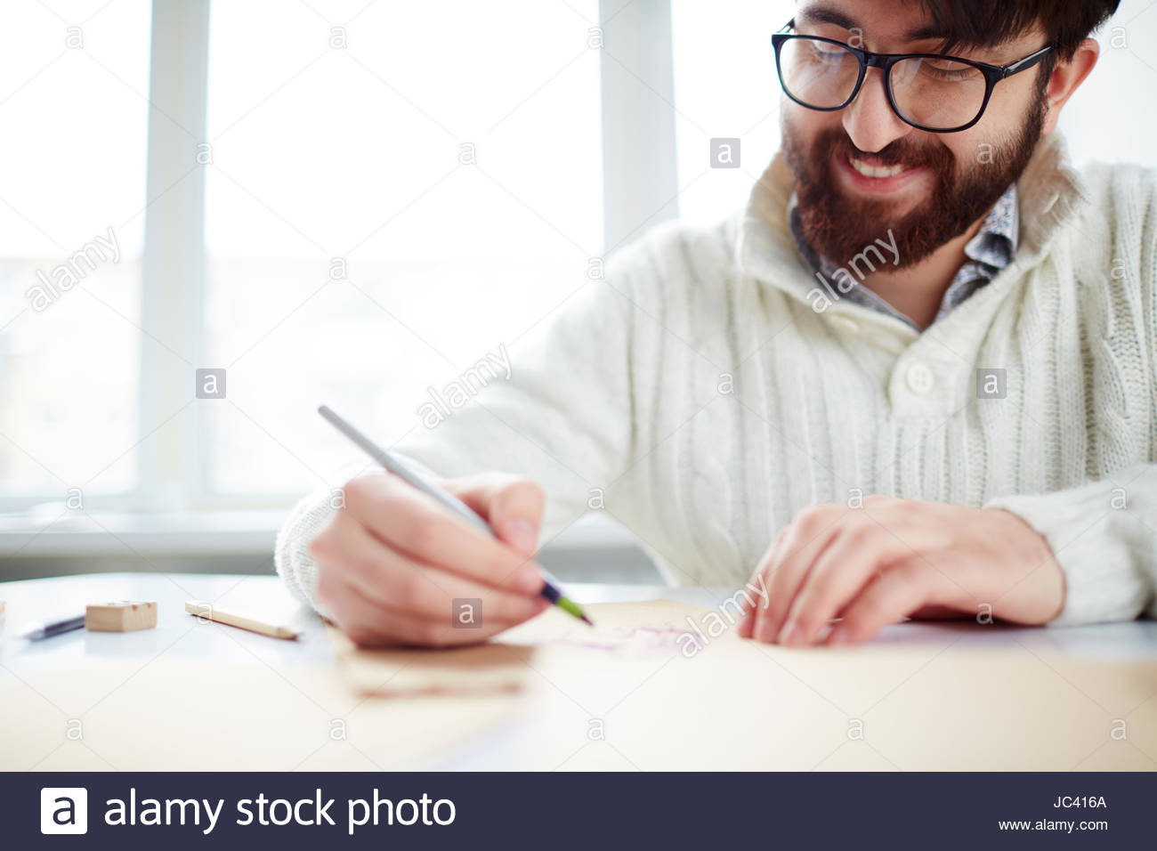 1300x956 Image Of Happy Young Man In Eyeglasses Drawing Stock Photo