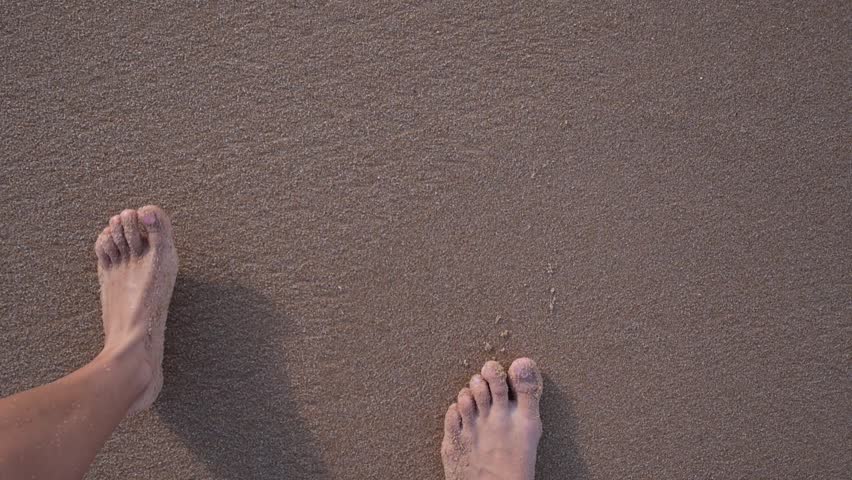 852x480 Woman Hand Drawing Heart On Sand. Sea Wave Erases