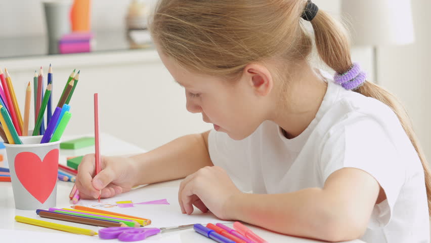 852x480 White 7 Years Old Girl Drawing And Coloring On A Paper At Home