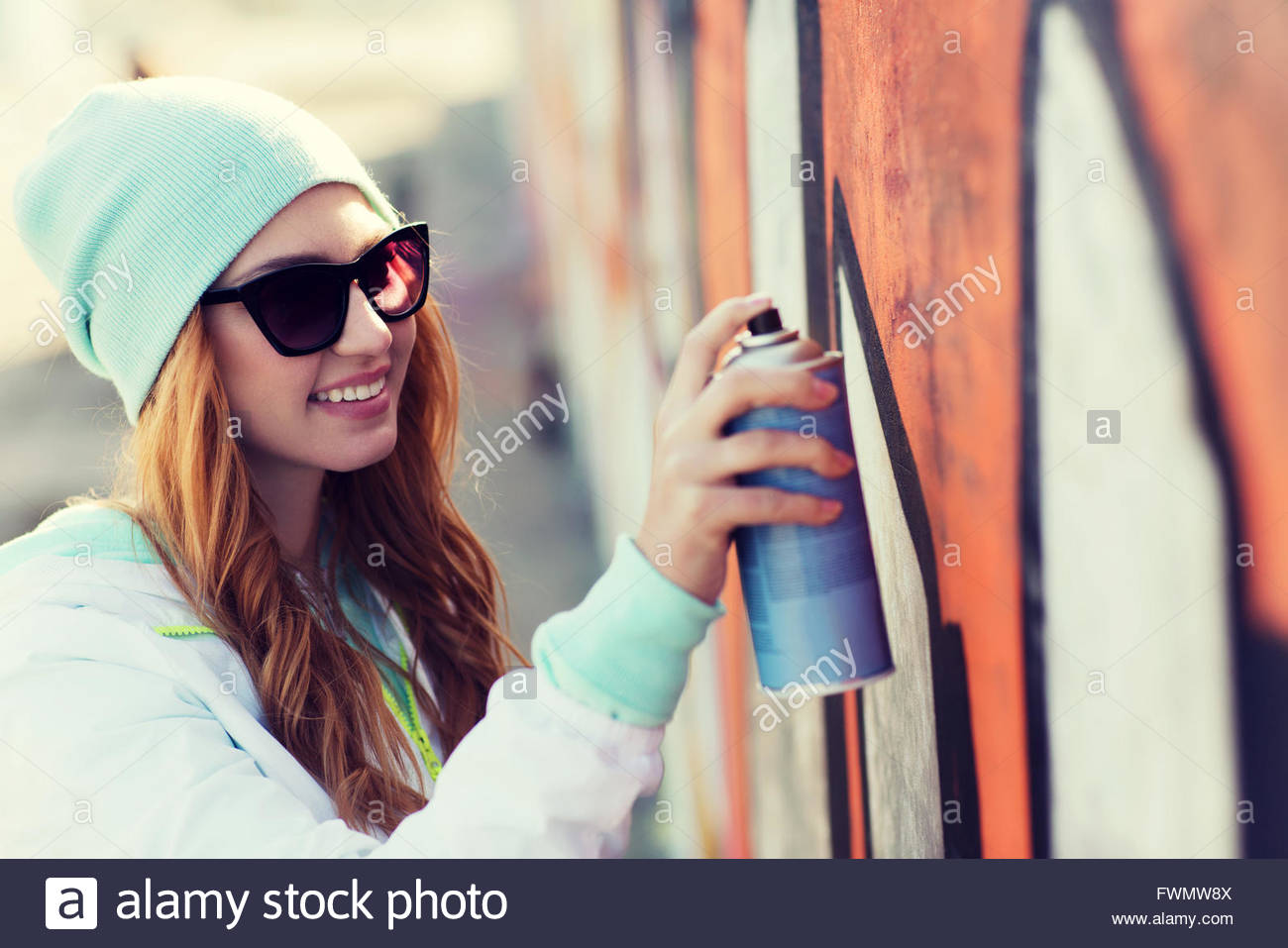 1300x957 Teenage Girl Drawing Graffiti With Spray Paint Stock Photo