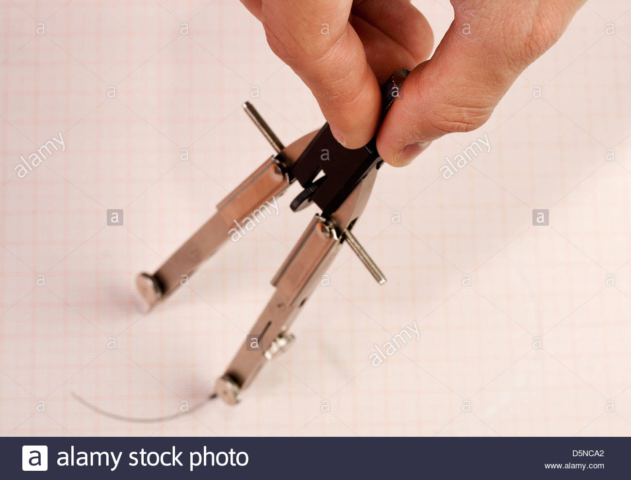 1300x989 Hand Drawing A Circle With Drawing Compass On Graph Paper Stock