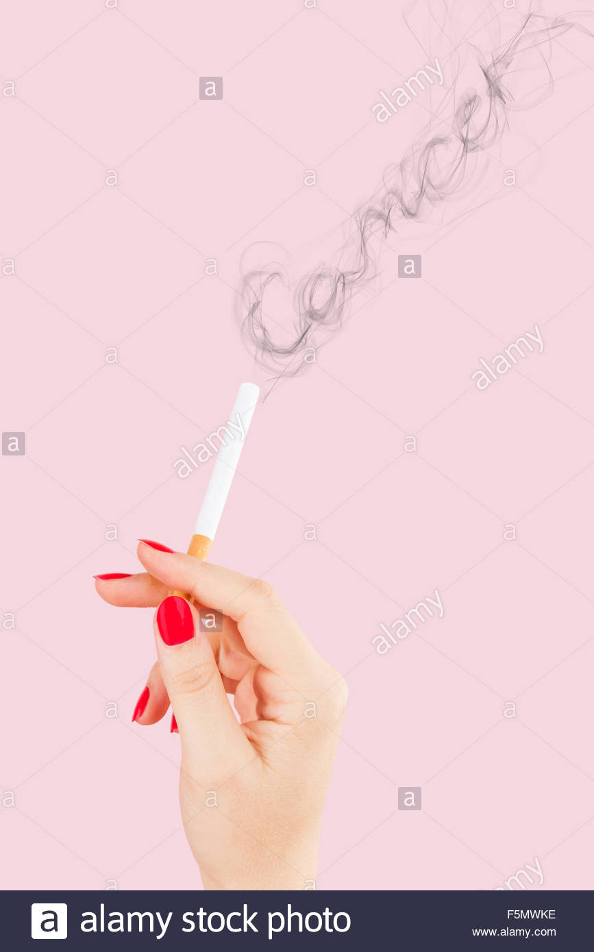 867x1390 Female Hand Holding Cigarette, Smoke Forming The Word Cancer