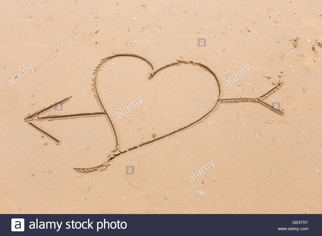 1300x956 Heart And Arrow Drawn In The Smooth Beach Sand. Love Concept Stock