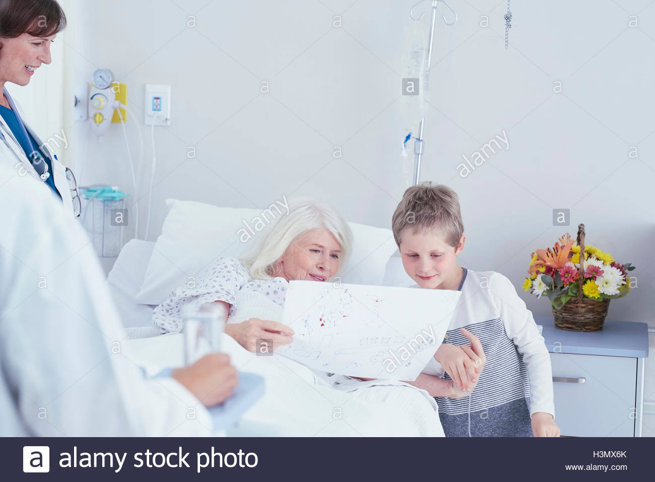 1300x956 Senior Female Patient In Hospital Bed Looking