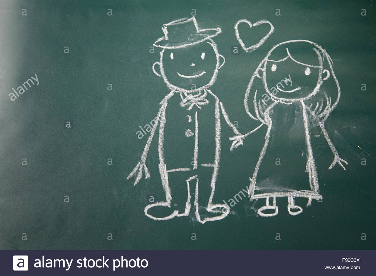 1300x956 Drawing On The Chalkboard Husband And Wife In Love Stock Photo