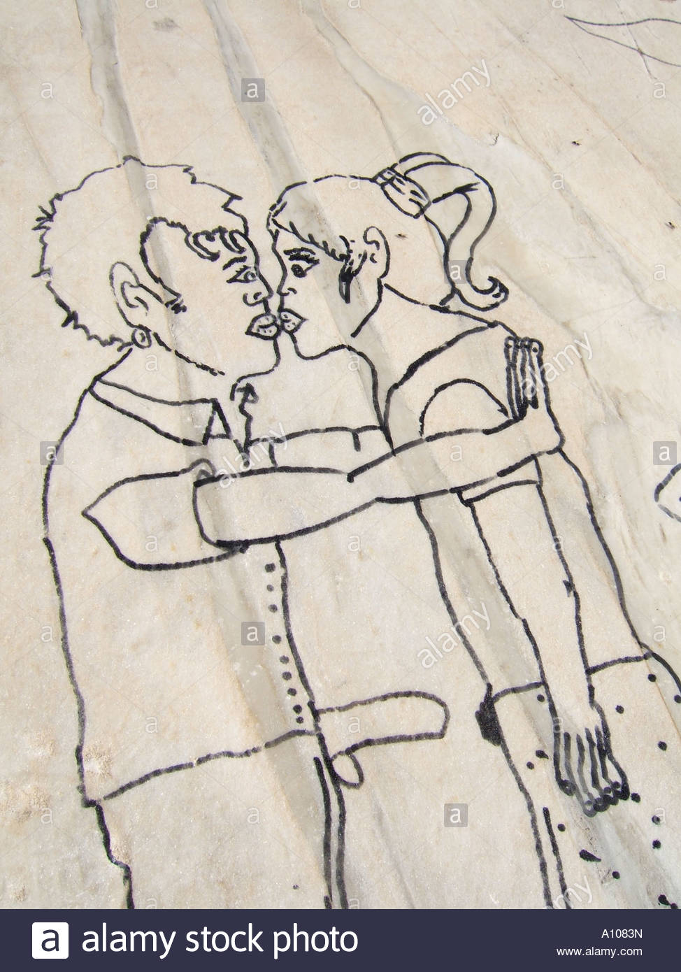974x1390 Drawing Of Young Couple Kissing On Wall Stock Photo 10100648