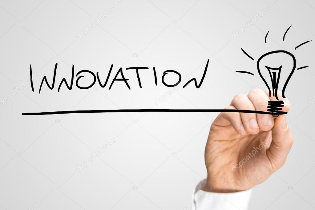 1023x682 Male Hand Drawing Light Bulb And Writing Word Innovation Stock
