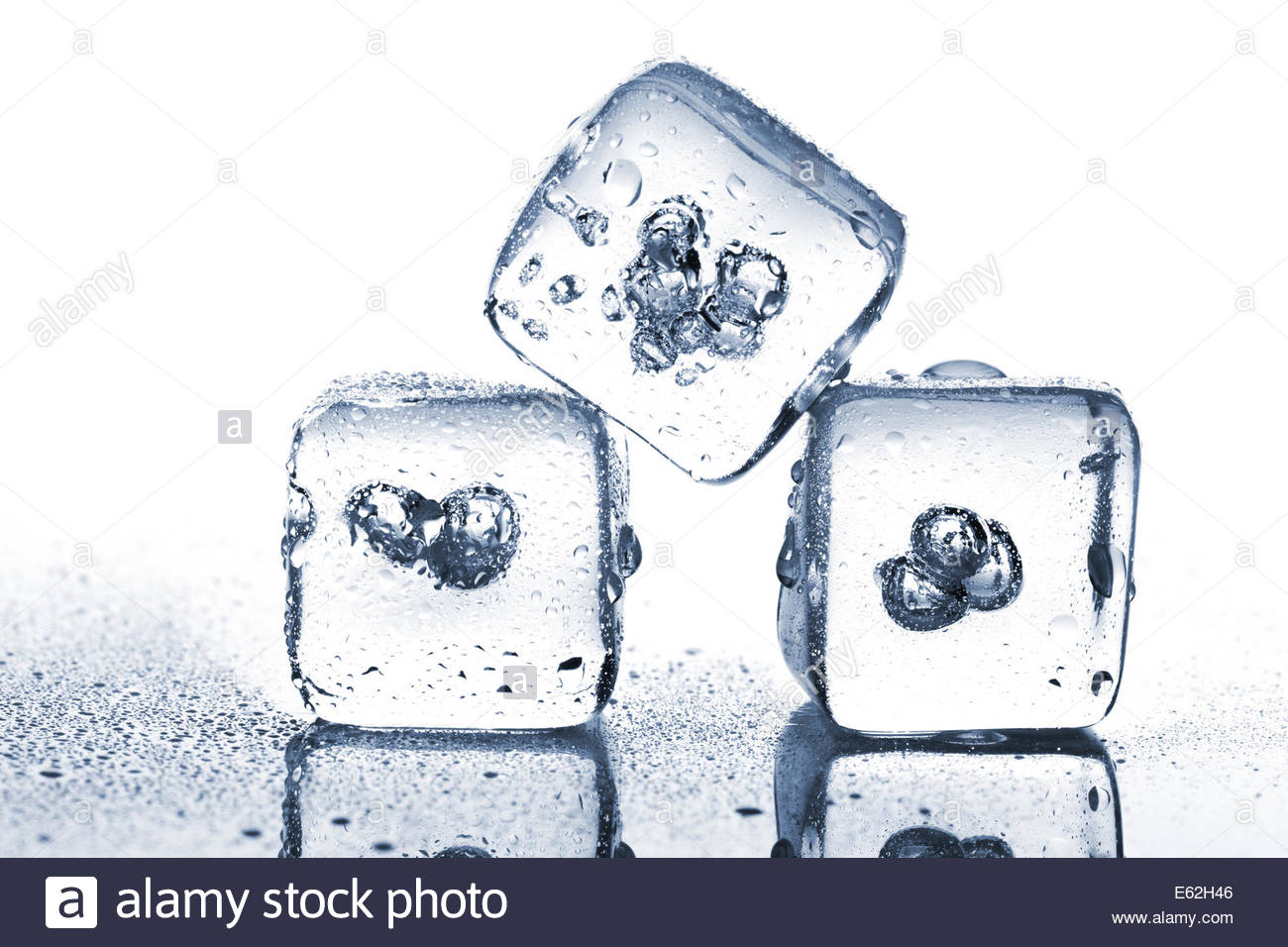 1300x956 Three Melting Ice Cubes With Water Dew On White Background Stock
