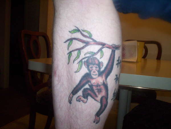 600x453 Monkey Hanging On Tree Tattoo On Leg Calf