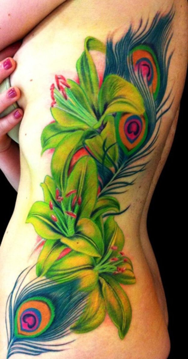 600x1145 Sexy Ribs With Peacock Feather And Lily Flower Tattoos