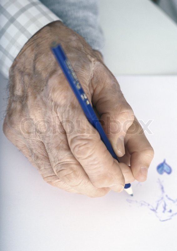 566x800 Elderly Man's Hand Drawing With Colored Pencil Stock Photo
