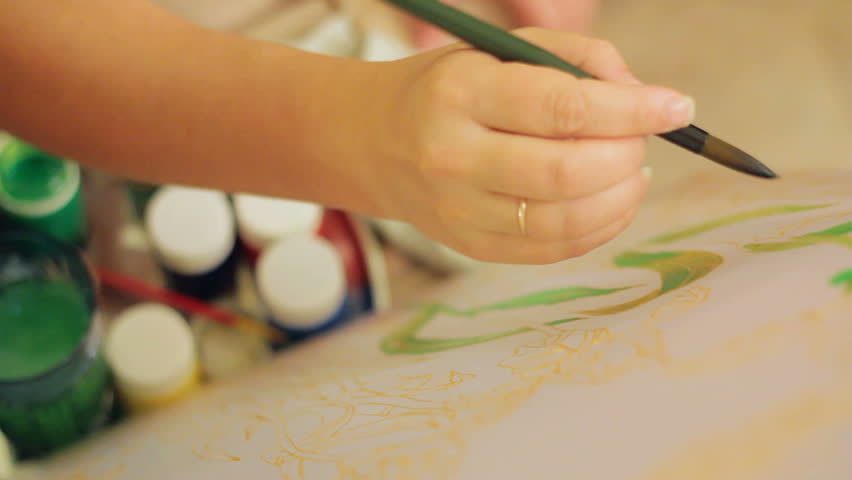 852x480 Two People Drawing On Textile Together. Batik Technique. Stock