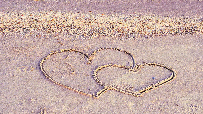 852x480 Two Hearts On Sand, Drawing On The Beach. Stock Footage Video