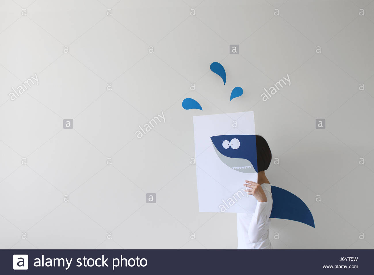 1300x956 Woman Holding Paper With A Shark Drawing And Wearing A Shark Fin