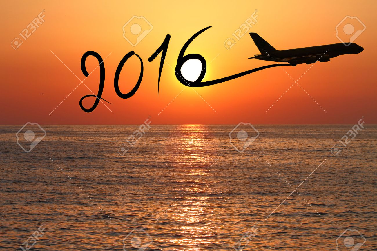 1300x866 New Year 2016 Drawing By Airplane On The Air At Sunset Stock Photo