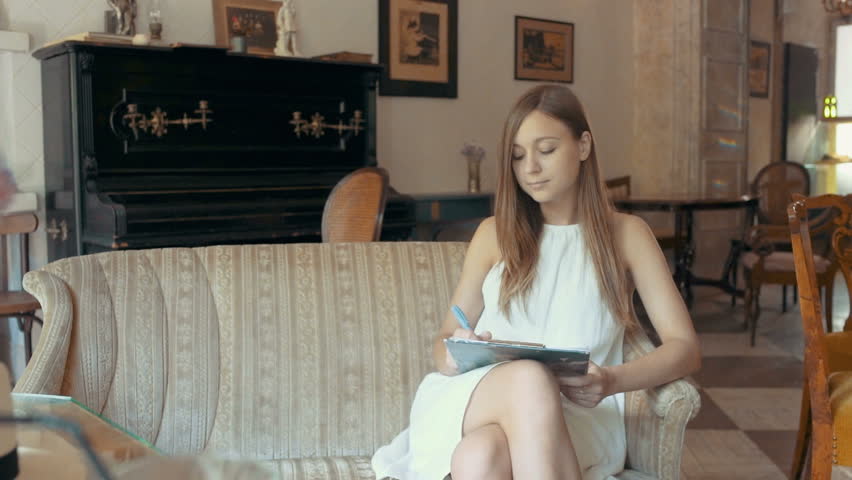 852x480 Young Woman Drawing With Pencil On The Paper In Cafe Stock Footage