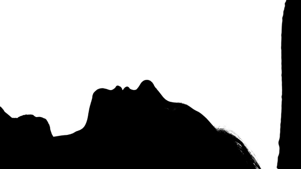 590x332 Girl Is Lying On The Bed With Her Kissing Guy. Silhouette. White