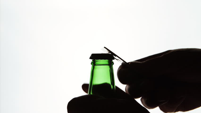 852x480 Close Up The Silhouette Of Male Hands Opening Green Beer Bottle