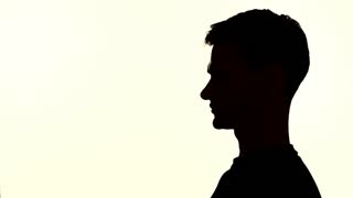 320x180 Shadow Silhouette Of A Woman Drinking From Beer Bottle Stock Video