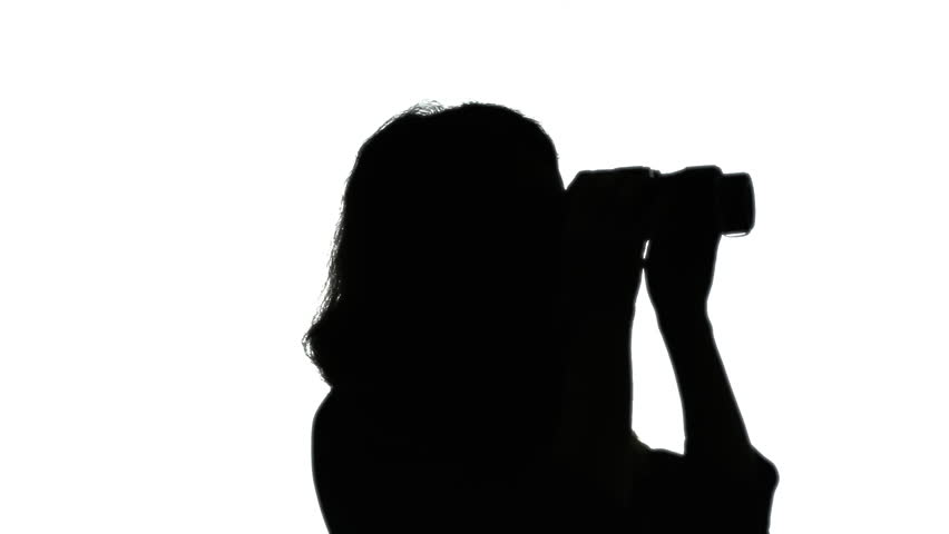 852x480 Silhouette Shot A Woman Looking Through A Pair Of Binoculars