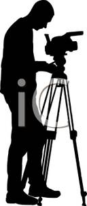 128x300 Silhouette Of A Photographer Setting Up His Camera For A Photo