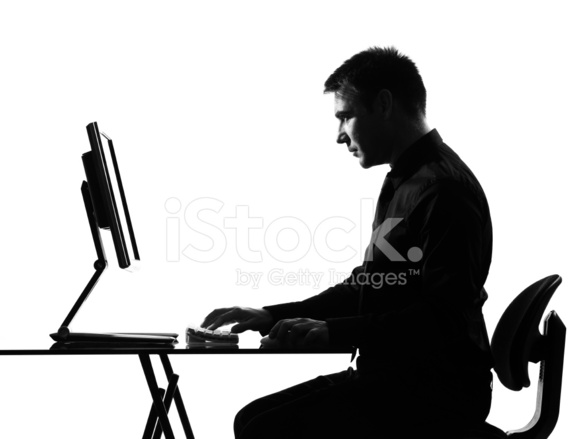 588x439 Silhouette Serious Man Computing Computer Stock Photos