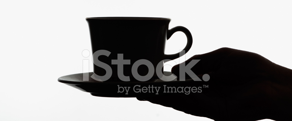 1024x426 Silhouette Of Hand Holding A Cup Stock Photos