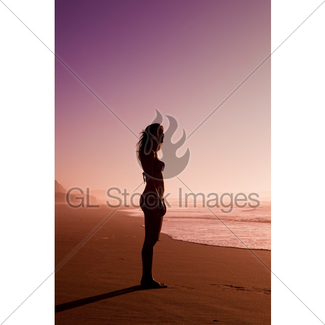 325x325 Silhouette Asian Girl Walking On A Beach Gl Stock Images