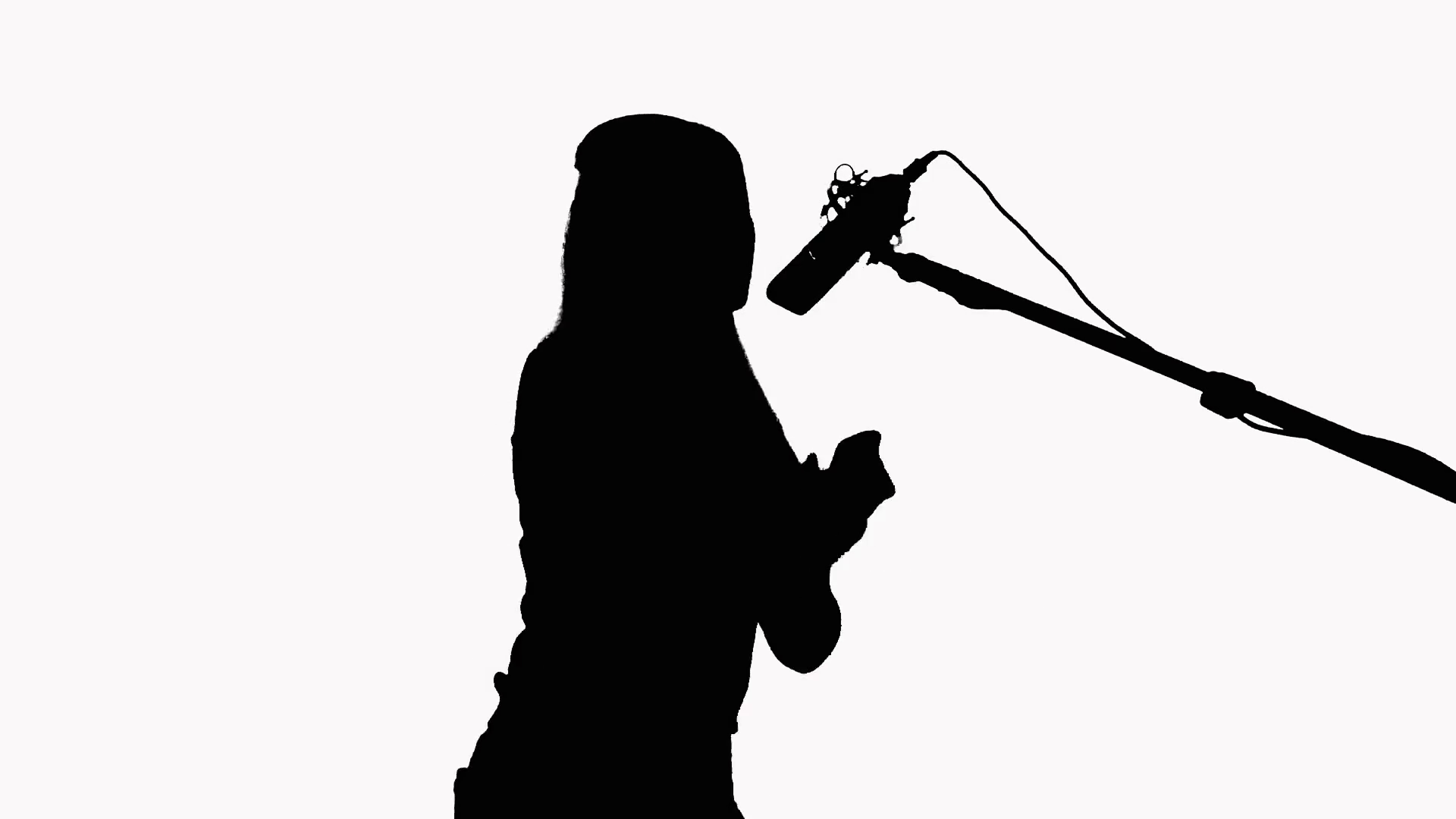 1920x1080 Silhouette Of A Girl With Long Hair Who Sings Into A Studio