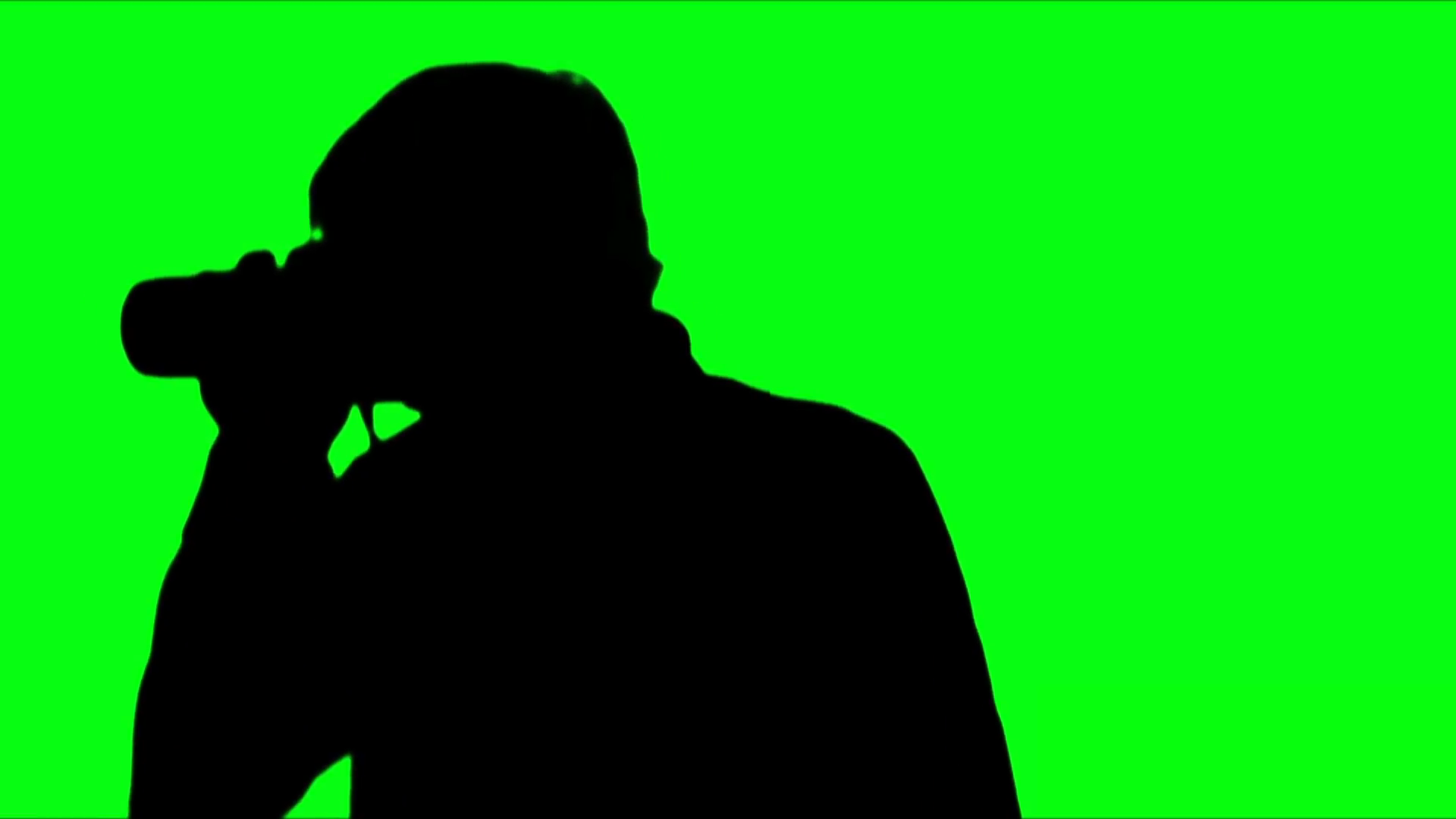 1920x1080 Photographer Silhouette Against Green Stock Video Footage