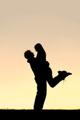 160x240 Silhouette Of Happy Young Couple Hugging Outside