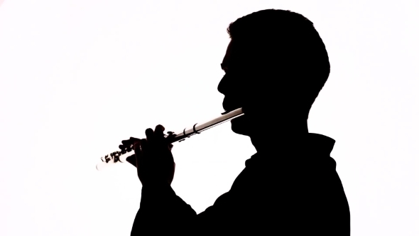 590x332 Isolated Silhouette Of A Guy Playing The Flute By Envatoreal