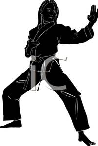 201x300 Of A Girl In A Backstance Doing A Block Wearing A Karate Uniform