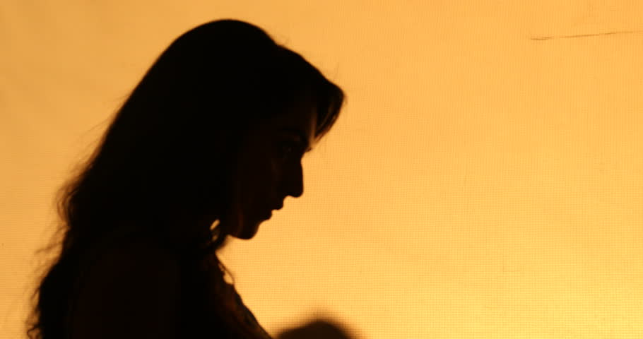 910x480 Silhouette Of The Woman Standing And Looking At Beautiful Sunset