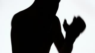 320x180 Silhouette Of A Sporting Young Man During Training On Fights