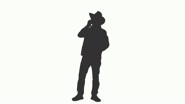 590x332 Silhouette Of A Man In Cowboy Hat Talking On Smartphone, Alpha