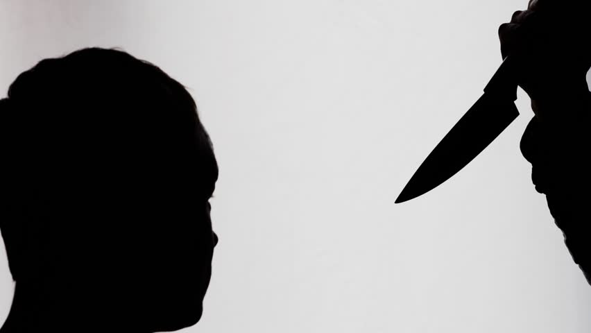 852x480 Silhouette Of A Man Carry A Knife Follows A Young Woman In A Dark
