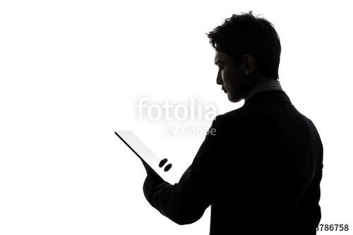 500x334 Silhouette Of Businessman Looking Tablet Pc. Stock Photo