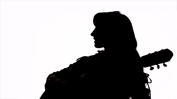 590x332 Silhouette. Isolated. Girl Playing Guitar. Profile
