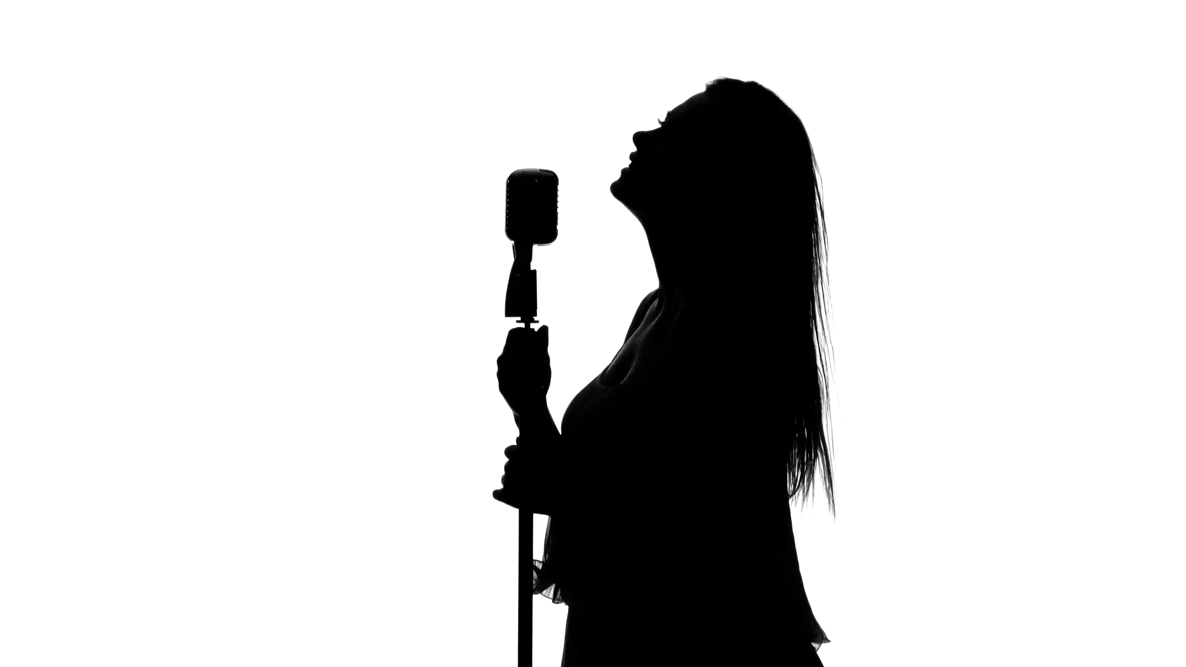 3840x2160 Singer Sings The Song With A Microphone. White. Silhouette Stock